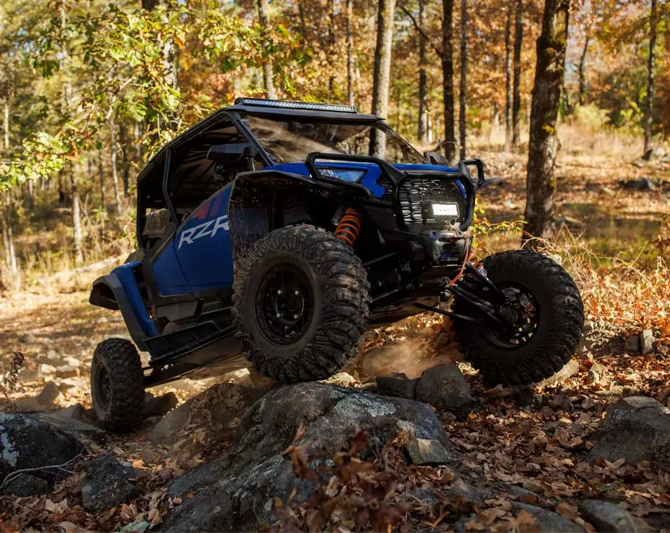 2025 Polaris RZR Trail 50-inch sport trail UTV on a narrow path