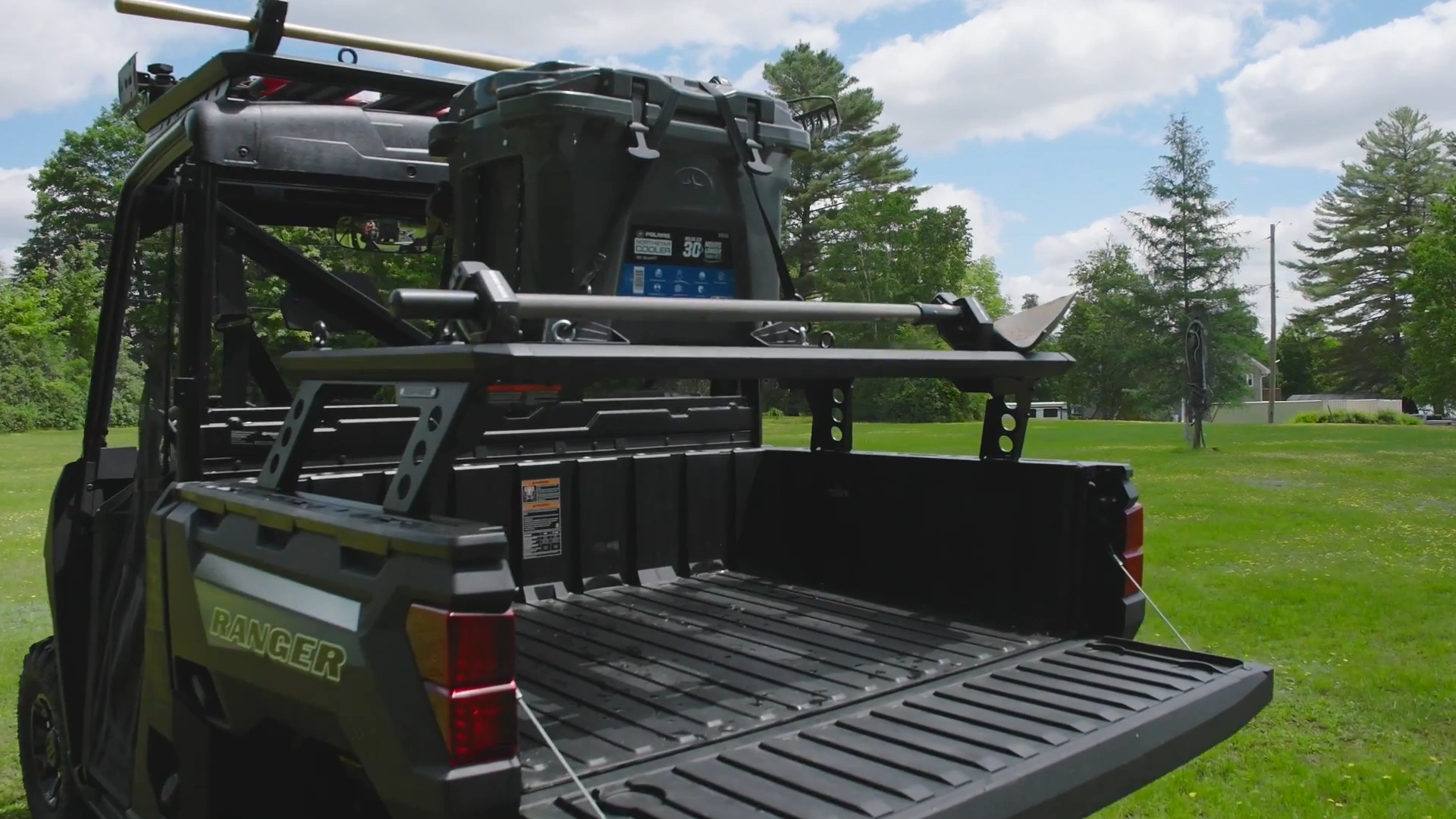 Ranger XP 1000 dumping firewood from the 1,000 pound cargo box.