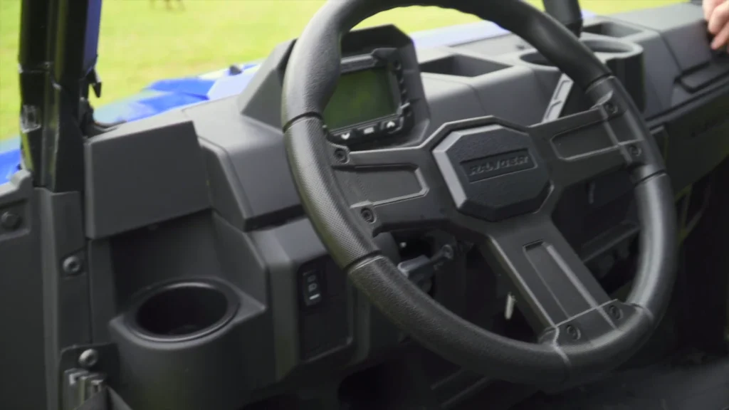 Ranger XP 1000 cab interior with bench seat and under seat storage.