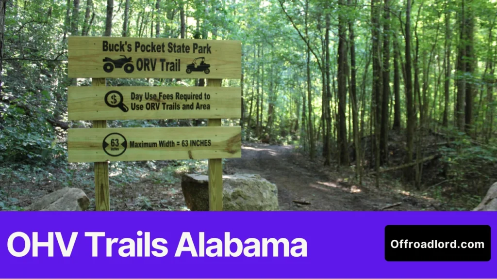 Riders at an OHV trailhead in Alabama checking a map board and rules signage before riding, showing OHV trails Alabama planning.